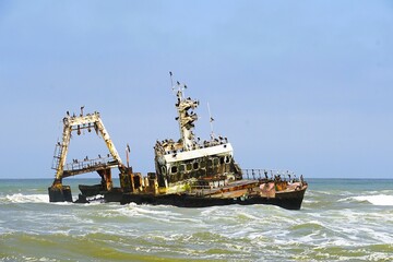 Photograph of the Zeila wreck, a stranded fishing boat on the Skeleton Coast near Namibia in the Atlantic Ocean. 