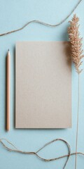 Ultra realistic flat lay with blank card and pencil on blue background for design inspiration