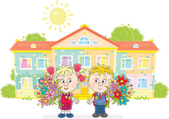 Happy little schoolboy and schoolgirl with schoolbags and flowers going to their pretty school on the first of September, vector cartoon illustration on a white background