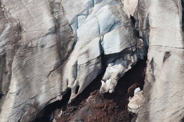 A cracked glacier on the slopes of Elbrus on a summer day