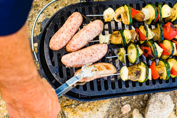 Grilled vegetables and meat on barbecue grill