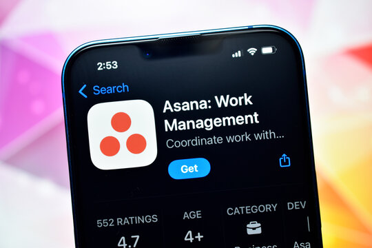 A detailed, close-up shot of an Apple iPhone displaying the App Store page for the 'Asana: Work Management' application. The screen shows the app icon, title, and a blue 'Get' button against a dark in