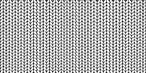 Close up view of a knitted fabric texture with a repeating pattern