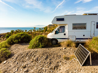 Caravan camping on sea shore, Spain.