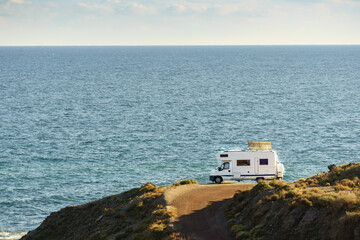 Caravan with tilt solar panels on roof.
