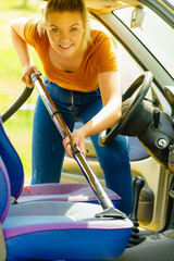 Cleaning car interior with vacuum cleaner