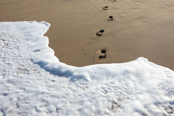 footprints in beach sand