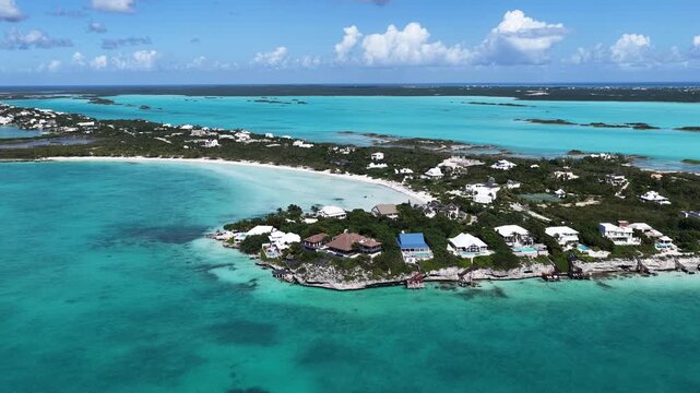 Taylor Bay Beach In Providenciales Overseas Territory Turks And Caicos Islands. Turquoise Ocean Waves Gently Crashing On Tropical Beach. Shore Sky Clouds Beach Sea. Seaside Panorama.