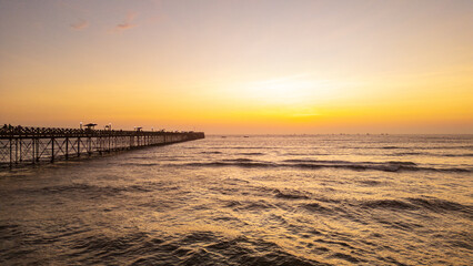 Summer sunset at the port of Pimentel, with a view of the pier in Chiclayo, Lambayeque, on the Peruvian coast