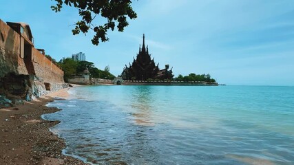Pattaya, Thailand, June 7, 2022: The Temple of Truth (Prasat Sut Jatum), a beautiful wooden Buddhist temple by the sea. The Temple of Truth in Pattaya. A giant wooden structure located on Naklua Cape.