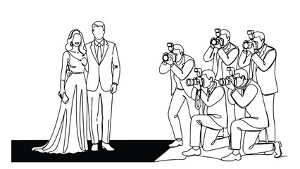 Elegant couple on red carpet with paparazzi