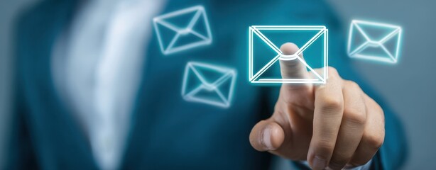The businessman interacting with digital email icons on a touchscreen interface.