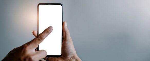 The smartphone with blank white screen being touched by a user's finger