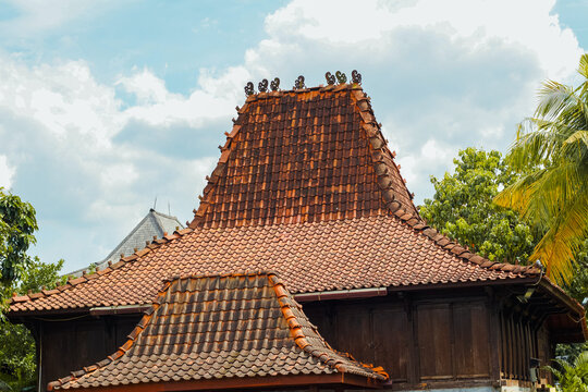 the roof of a traditional Javanese Joglo house. This style of house is commonly found in Central Java, East Java, and the Special Region of Yogyakarta, Indonesia. 