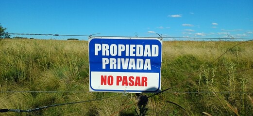 Private Property No Trespassing Sign - Rural Uruguay Farm Landscape Grassland © Nico Ladewig