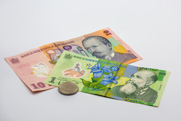 Romanian currency banknotes and coin closeup on white background
