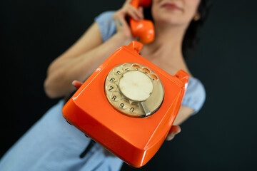 Young Woman Talking on a Retro Phone. Communication Concept.