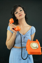 Young Woman Talking on a Retro Phone. Communication Concept.