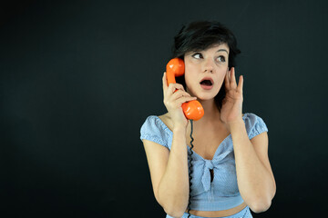 Surprised Young Woman Talking on Retro Phone. Communication Concept