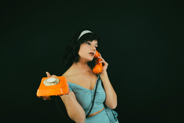 Young Woman Talking on a Retro Phone. Communication Concept.