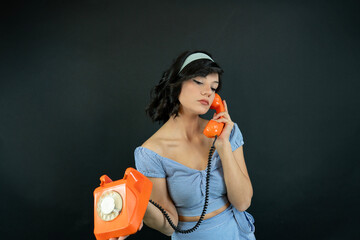 Young Woman Talking on a Retro Phone. Communication Concept.