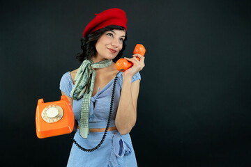 Young Woman Talking on a Retro Phone. Communication Concept.