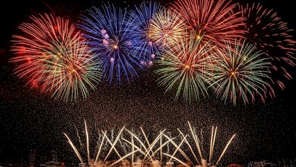 A breathtaking nocturnal display of colorful fireworks illuminating the dark sky with dazzling bursts of light, creating a stunning visual spectacle of celebration and joy during a festive event