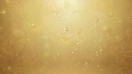Macro shot of golden bubbles rising in oil or champagne liquid background. - Powered by Adobe