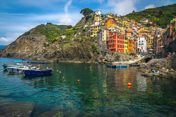 Colorful waterfront houses on the cliffs in Riomaggiare, Liguria, Italy