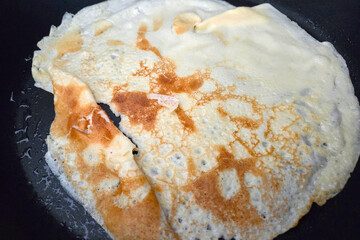 Golden Crepe Cooking in Non-Stick Pan for Breakfast Delight