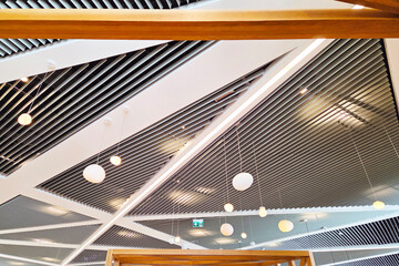 Modern Architectural Ceiling Design with Geometric Patterns and Pendant Lights