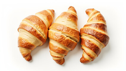Three flaky croissants on white surface. Top view