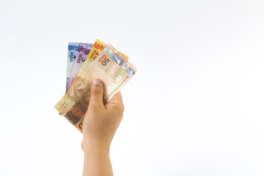 several Brazilian Real banknotes