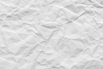 Close-up macro view of a wrinkled white paper surface,A high-angle view of a sheet of white paper, crumpled and wrinkled into an intricate, abstract texture. Perfect for backgrounds, mockups.