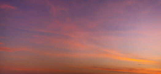 The backdrop features a sky and clouds of various colors during sunrise and sunset,Sunset sky for background or sunrise sky and cloud at morning.