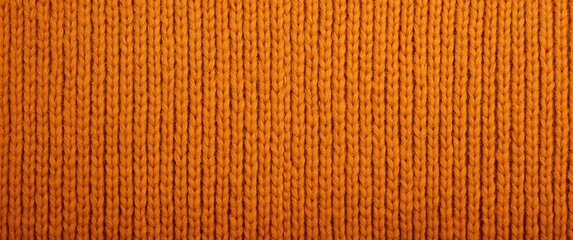 Close up orange ribbed knit fabric, studio sample used by knitwear designer, vertical ribs, soft wool texture, warm amber hue, tactile cozy mood, seasonal palette