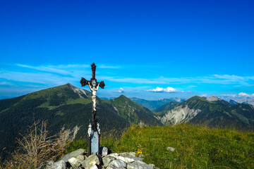 Spectacular sunset over the Karwendel mountains, with glowing peaks and dramatic alpine light.