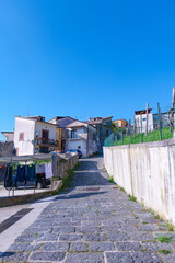 A narrow street among the old houses of Raviscanina, a small town in the province of Caserta, Italy.