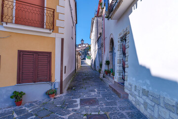 A narrow street among the old houses of Raviscanina, a small town in the province of Caserta, Italy.