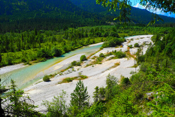 Spectacular sunset over the Karwendel mountains, with glowing peaks and dramatic alpine light.