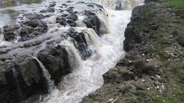 4K Aerial View of Flooded River with Muddy and Turbid Water Flow