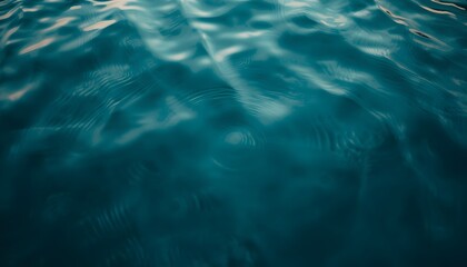 Obraz premium Blue Water Surface Ripples with Sunlight Reflections Abstract Texture Background