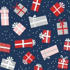 Fototapeta premium Festive Christmas gift boxes seamless pattern with red, pink, and grey presents on a dark blue snowy background