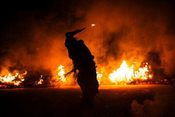 Krampus in the midst of flames is a demonic being that accompanies the religious folkloric figure. This tradition is linked to Christian mythology.