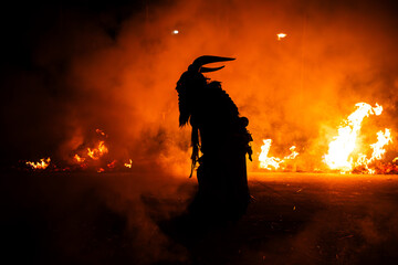 Krampus in the midst of flames is a demonic being that accompanies the religious folkloric figure....