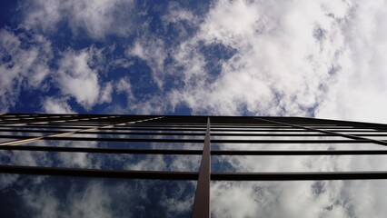 reflection of clouds on glass facade