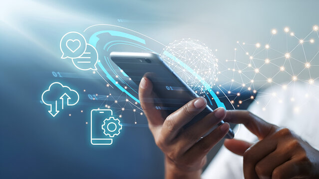 Hand holding smartphone with digital interface of icons and data streams - Powered by Adobe