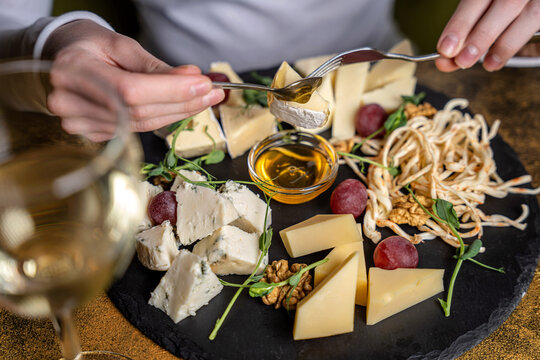 Luxury cheese platter with honey and wine