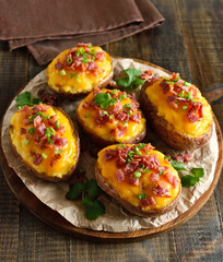 Baked stuffed potatoes with bacon, green onion and cheddar cheese
