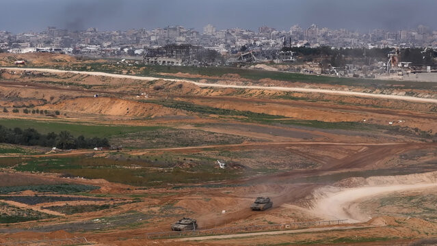 Aerial IDF Merkava Tanks Crossing Gaza Border
showing IDF Merkava tanks crossing back into Israel from Gaza in 2024.
